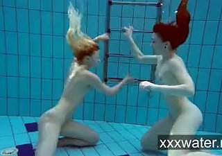 Milana together with Katrin league together eachother undersea